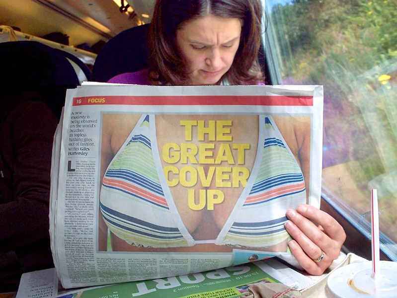 bikini boobs on reverse of newspaper make it look like the reader, etc.